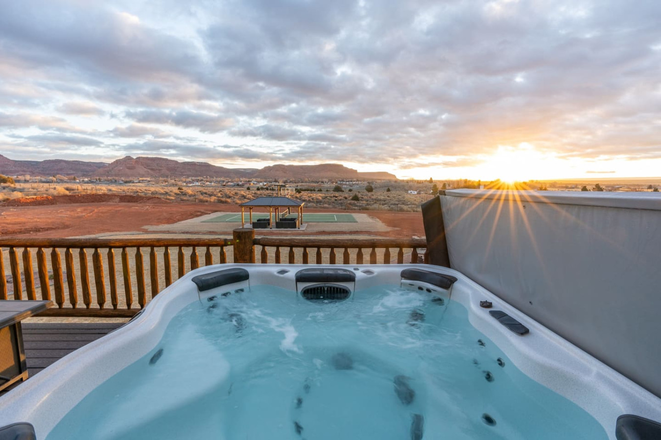 Hot tub on the deck of The Blackhawk Cabin at sunset, Kanab, UT